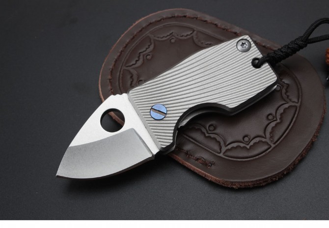 Small fat titanium handle folding knife (D2 steel)