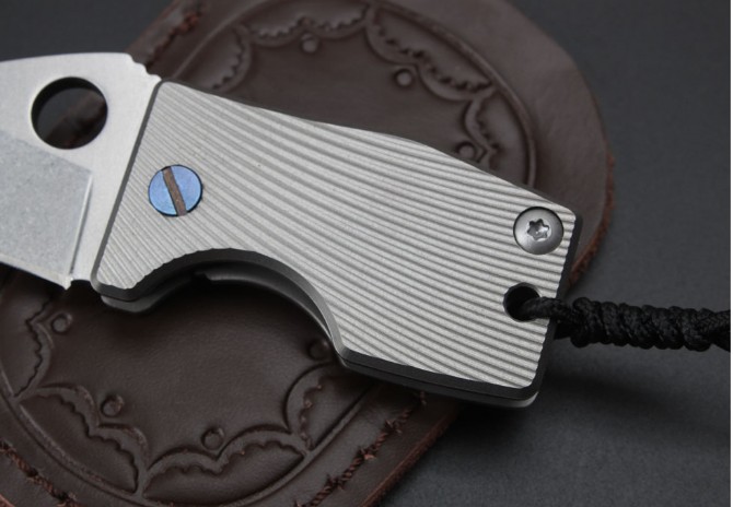 Small fat titanium handle folding knife (D2 steel)