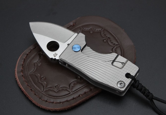 Small fat titanium handle folding knife (D2 steel)