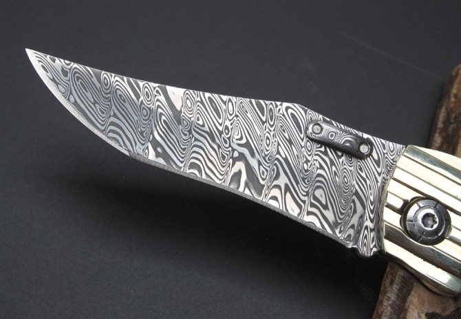 Imported Swiss powdered Damascus Blue Magic folding knife