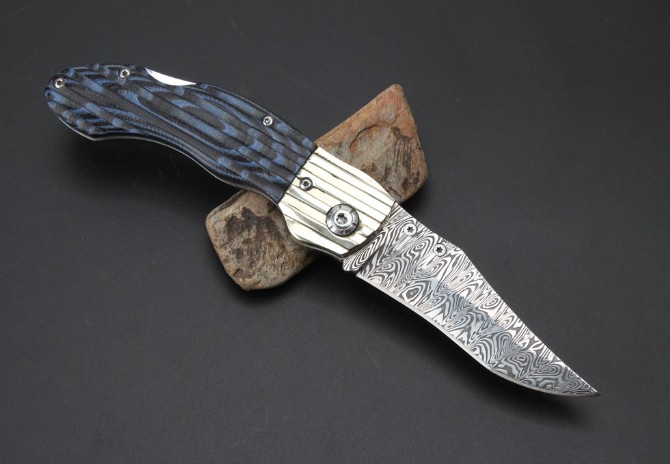 Imported Swiss powdered Damascus Blue Magic folding knife