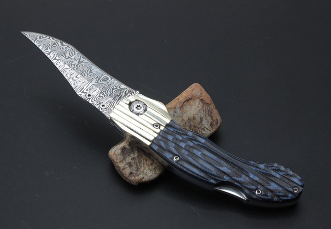 Imported Swiss powdered Damascus Blue Magic folding knife